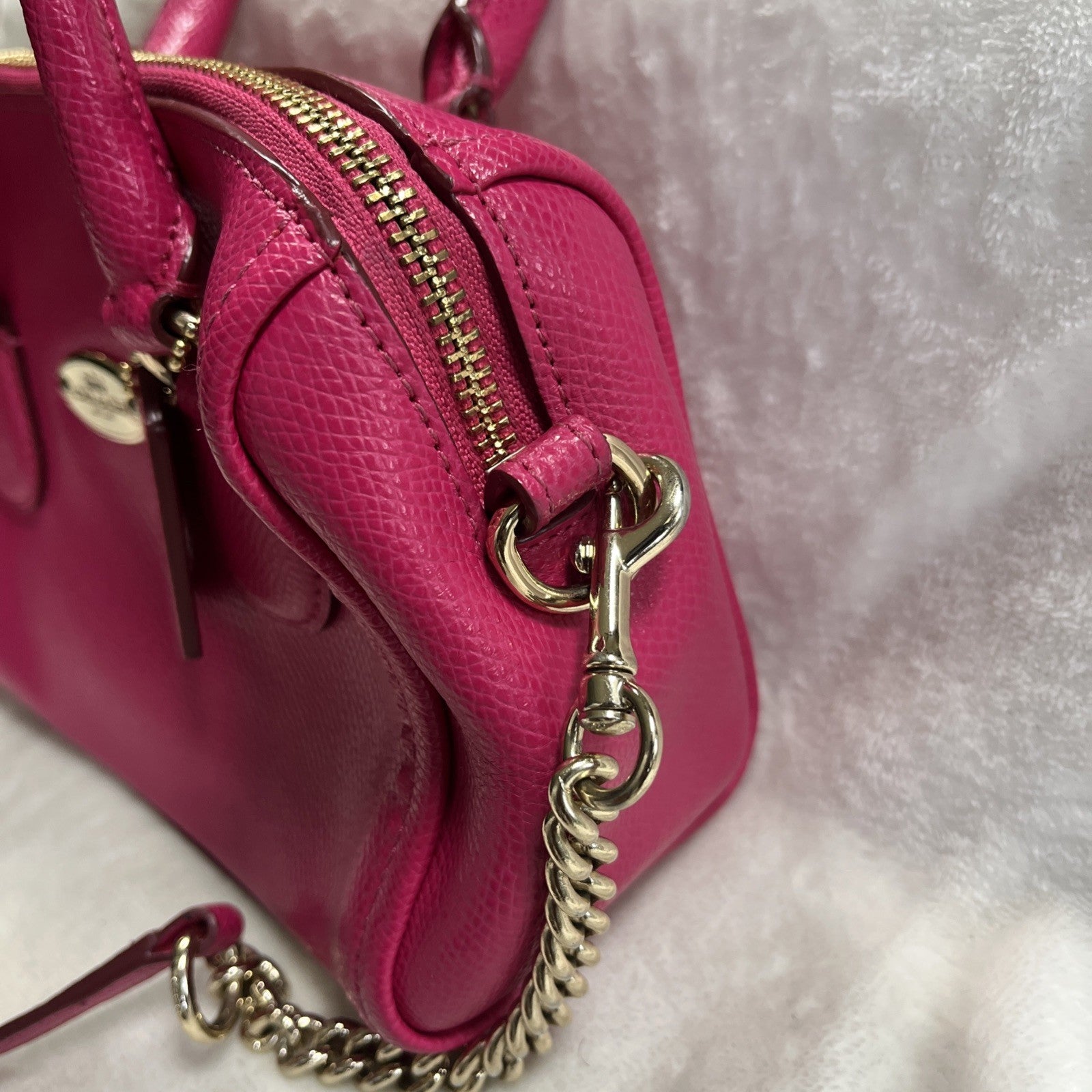 The Coach Crossgrain Pink Mini Bennett Satchel is a crossbody handbag purse