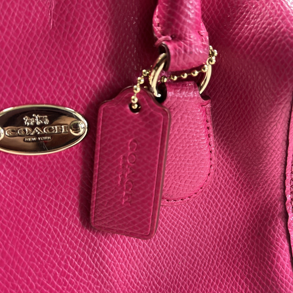 The Coach Crossgrain Pink Mini Bennett Satchel is a crossbody handbag purse