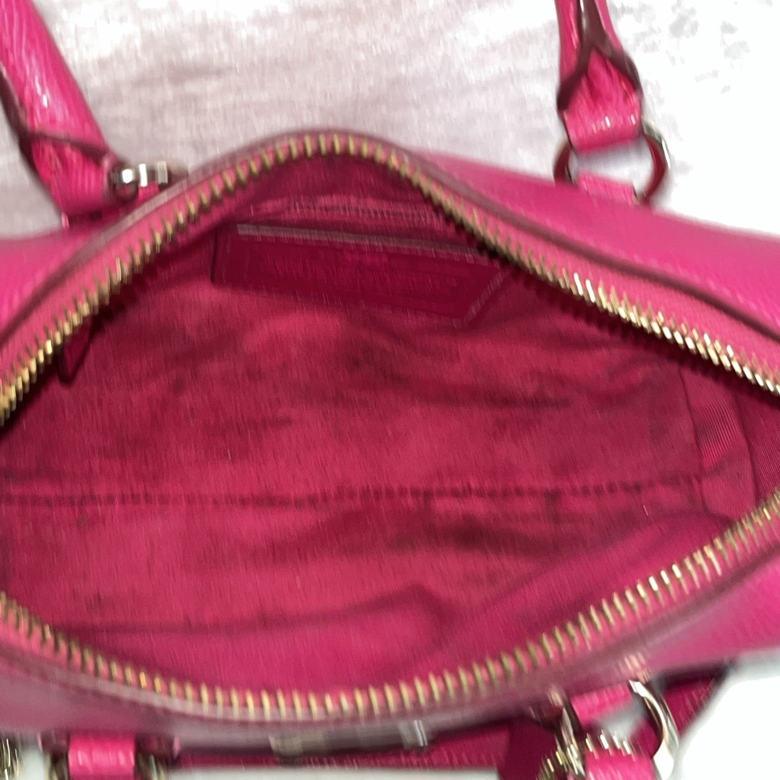 The Coach Crossgrain Pink Mini Bennett Satchel is a crossbody handbag purse