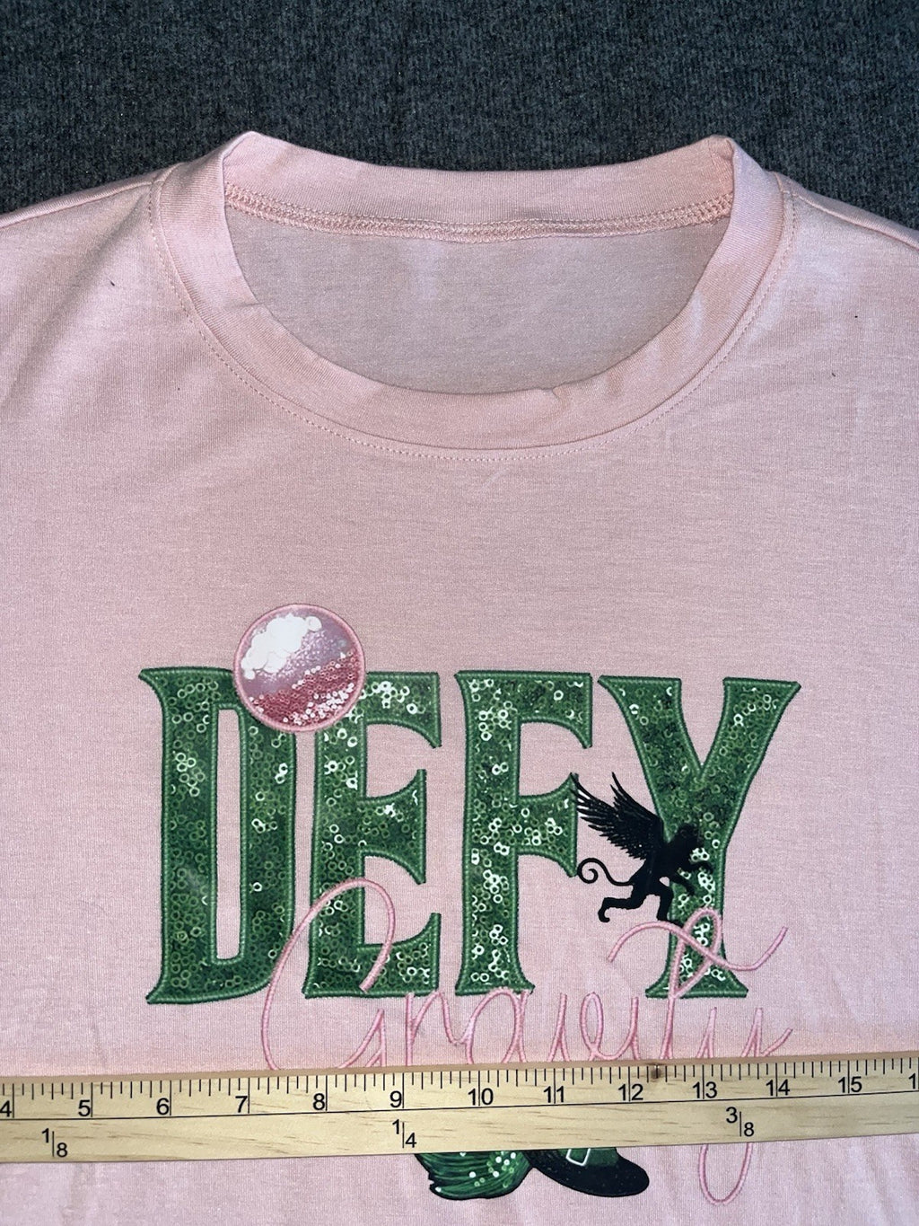 Defy Gravity Wicked Themed T Shirts Women’s XL. 