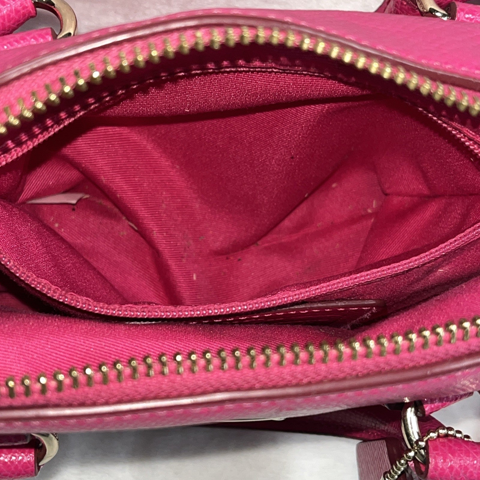 The Coach Crossgrain Pink Mini Bennett Satchel is a crossbody handbag purse