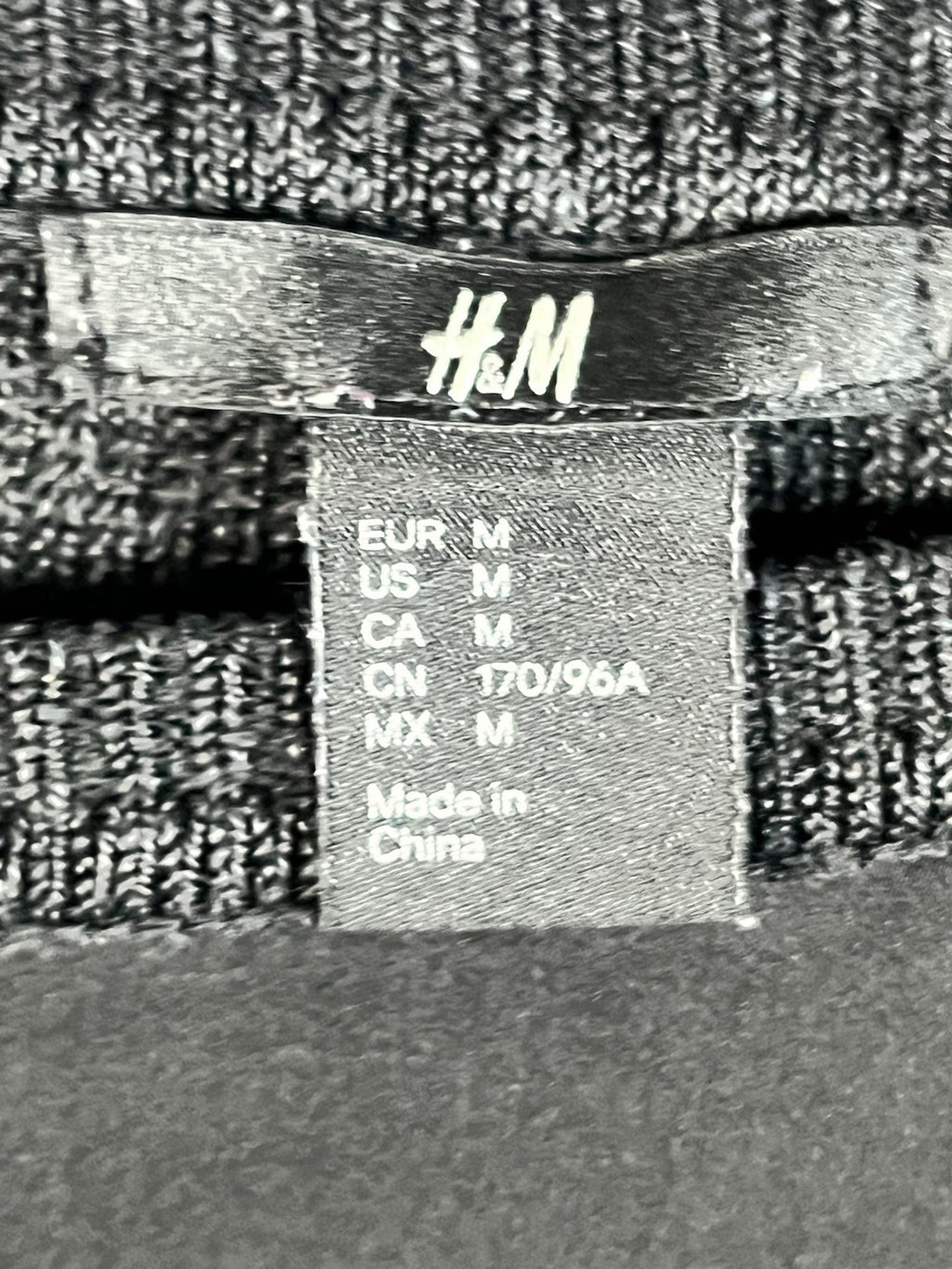 H&M black long-sleeved shirt with a shiny front panel and ribbed sleeves M 