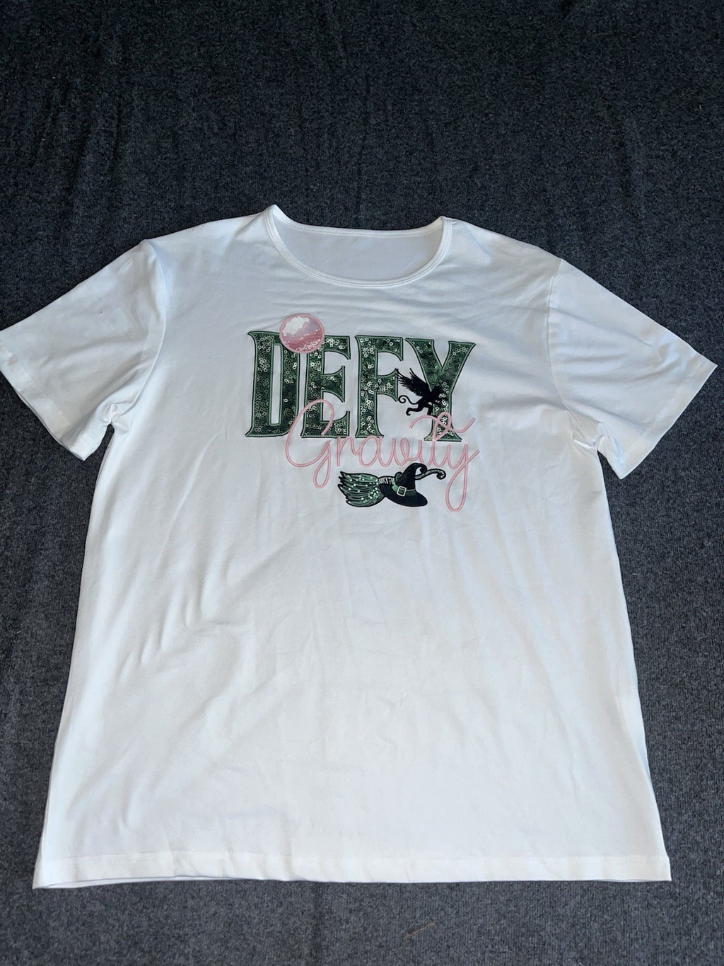Defy Gravity Wicked Themed T Shirts Women’s XL. 