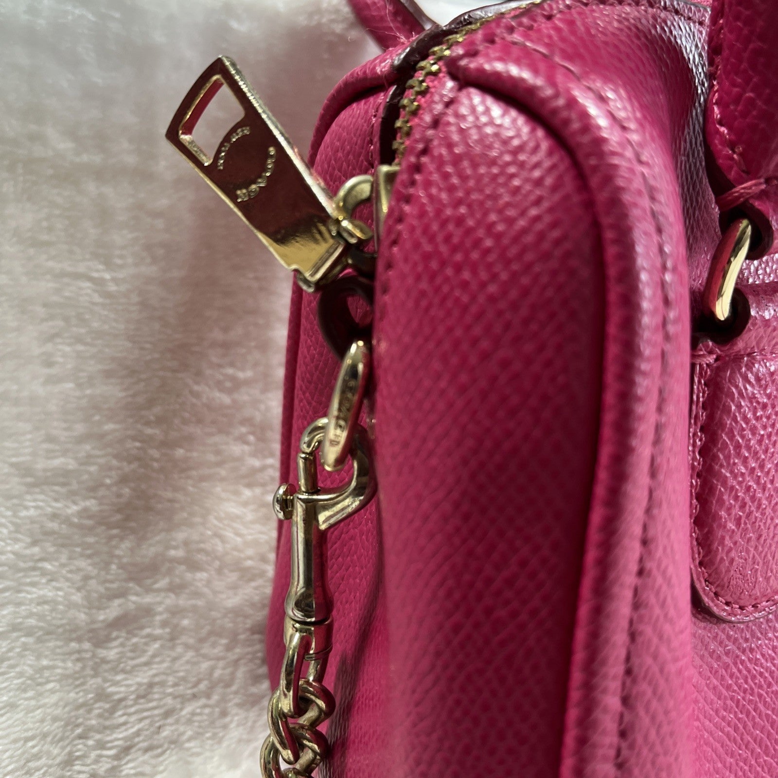 The Coach Crossgrain Pink Mini Bennett Satchel is a crossbody handbag purse