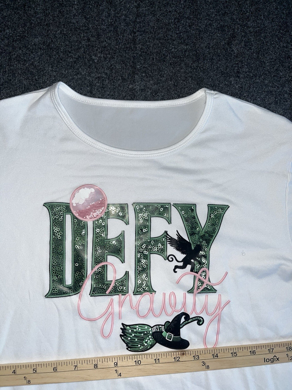 Defy Gravity Wicked Themed T Shirts Women’s XL. 